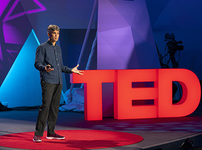 Enrico Ramirez-Ruiz speaking on stage
