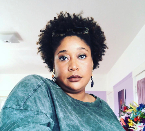 Graduate student organizing community workshops on the queer Black experience