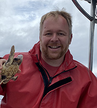 Elliott Hazen holding a turtle