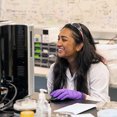A student at a computer in Marco Rolandi's lab.