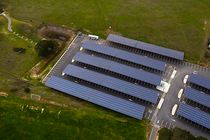 Aerial view of solar panels on a roof of a building