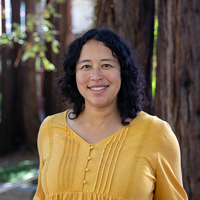 Portrait of Angela Brooks in front of redwood trees