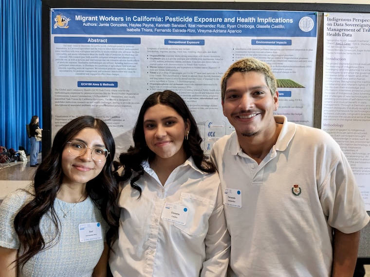 UC Santa Cruz students in front of research poster