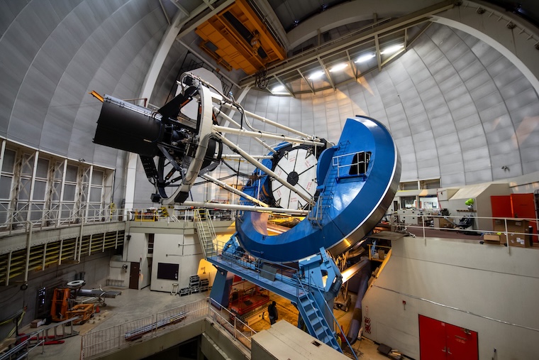 Large blue telescope housed under observatory dome