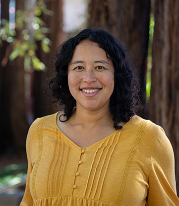 Portrait of Angela Brooks in front of redwood trees