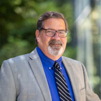 Brent Haddad on the UCSC campus in front of a building