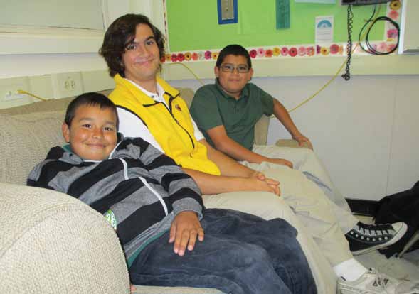 Cassidy Kakin with two students from Clyde L. Fischer Middle School, where Kakin works (photo by Peggy Townsend)