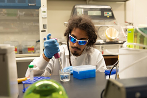 iGEM team member Thiago Brasileiro Feitosa is shown working in the lab.