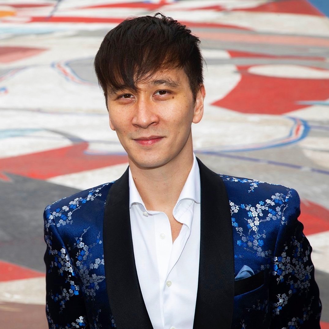artist/choreographer phil chan in blue suit