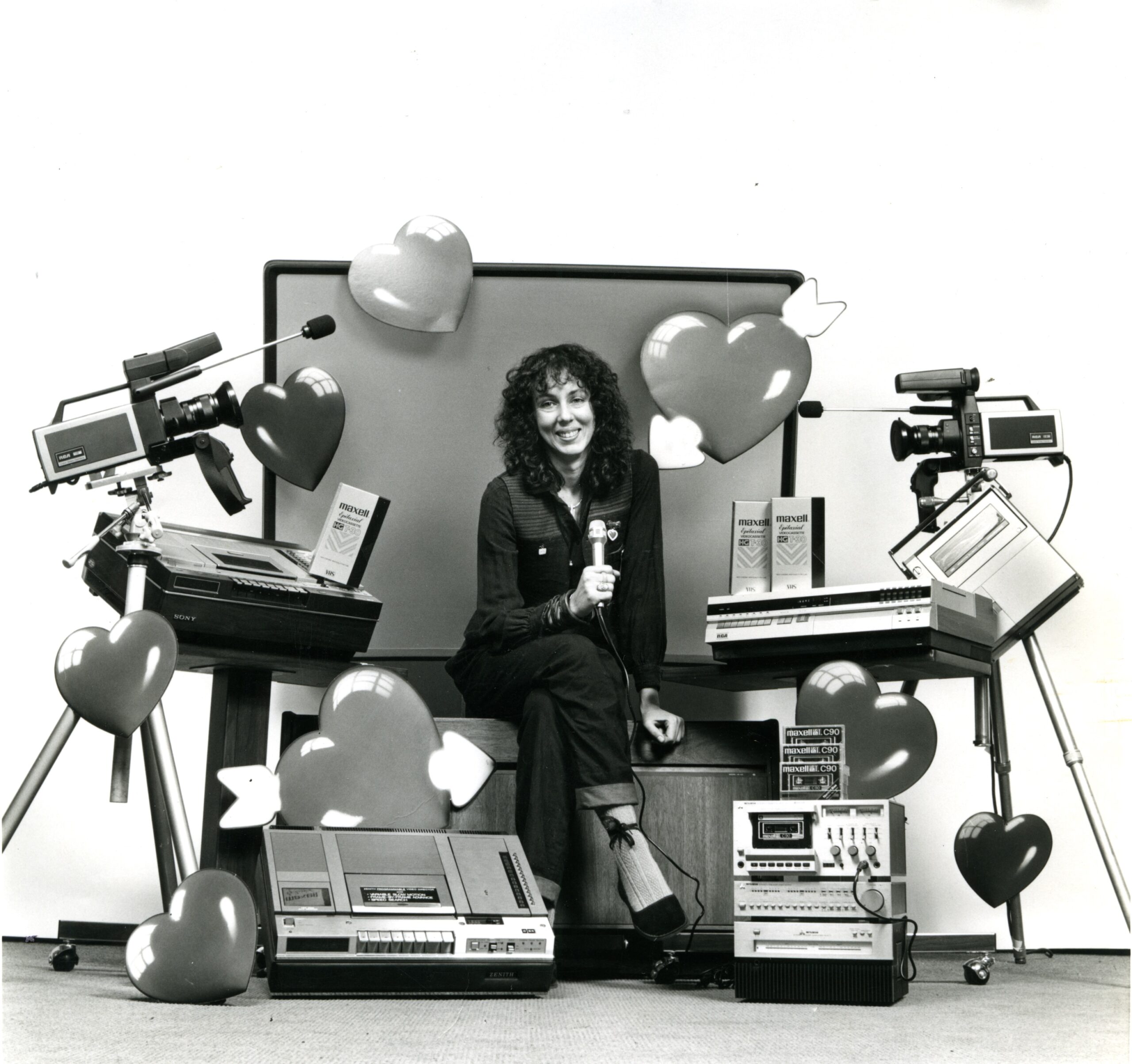 video artist wendy clarke posing with equipment and hearts