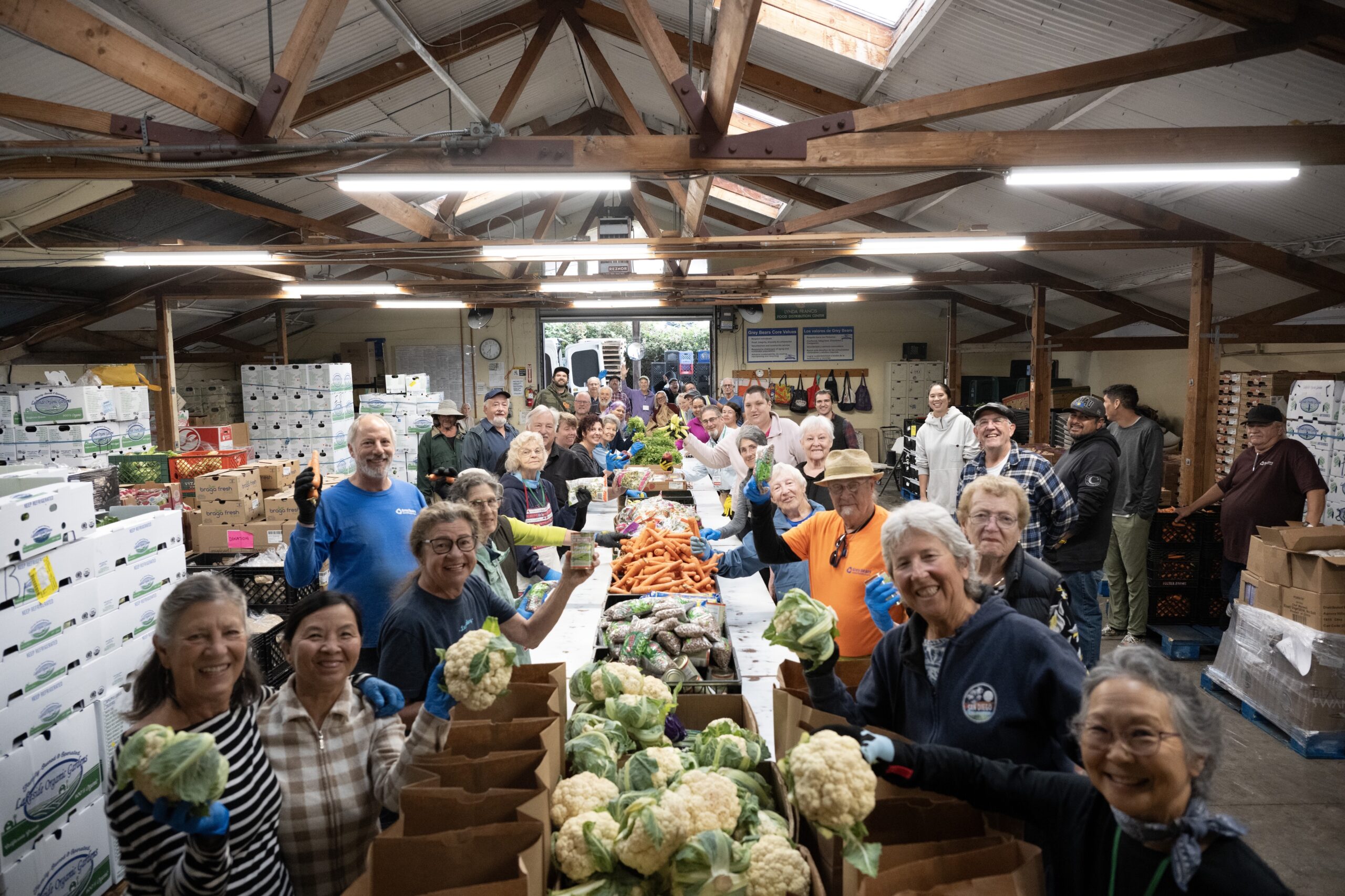 Grey Bears volunteers help bag fresh produce