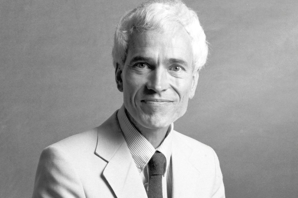 Photograph of Michael Cowan in a light colored suit