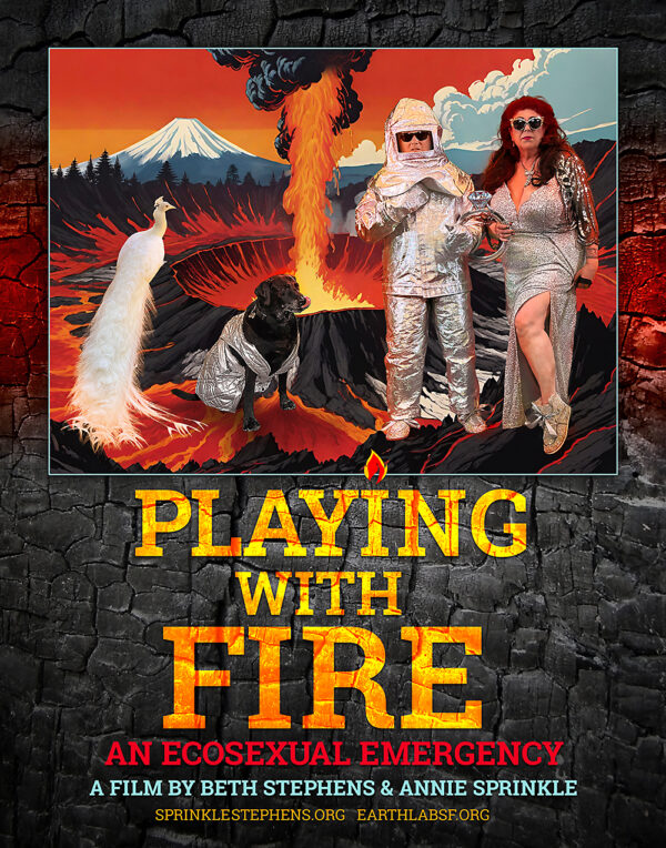 Poster for the film Playing with Fire: An Ecosexual Emergency by Beth Stephens and Annie Sprinkle. The central image shows a dramatic volcanic landscape with a white peacock, a black dog in a silver suit, and two women dressed in sparkling silver outfits—one in a fireproof suit and the other in a glamorous gown. Text below reads “PLAYING WITH FIRE: An Ecosexual Emergency. A Film by Beth Stephens & Annie Sprinkle.”
