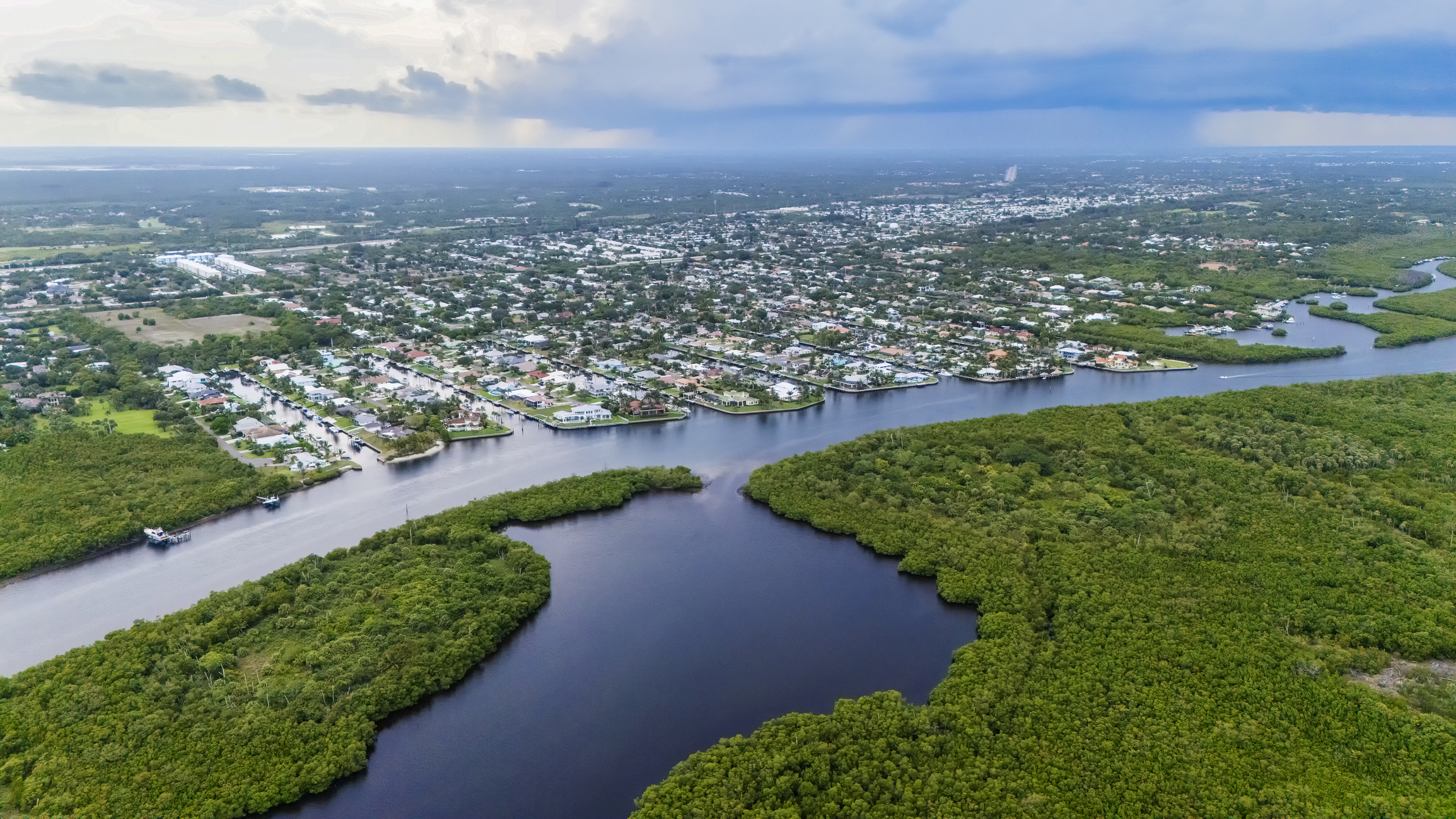Aerial shot Florida homes surrounded by mangroves
