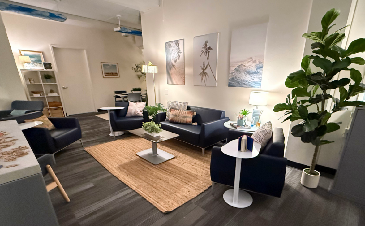 Cove lounge space. Couch, two chairs and peaceful artwork on the wall