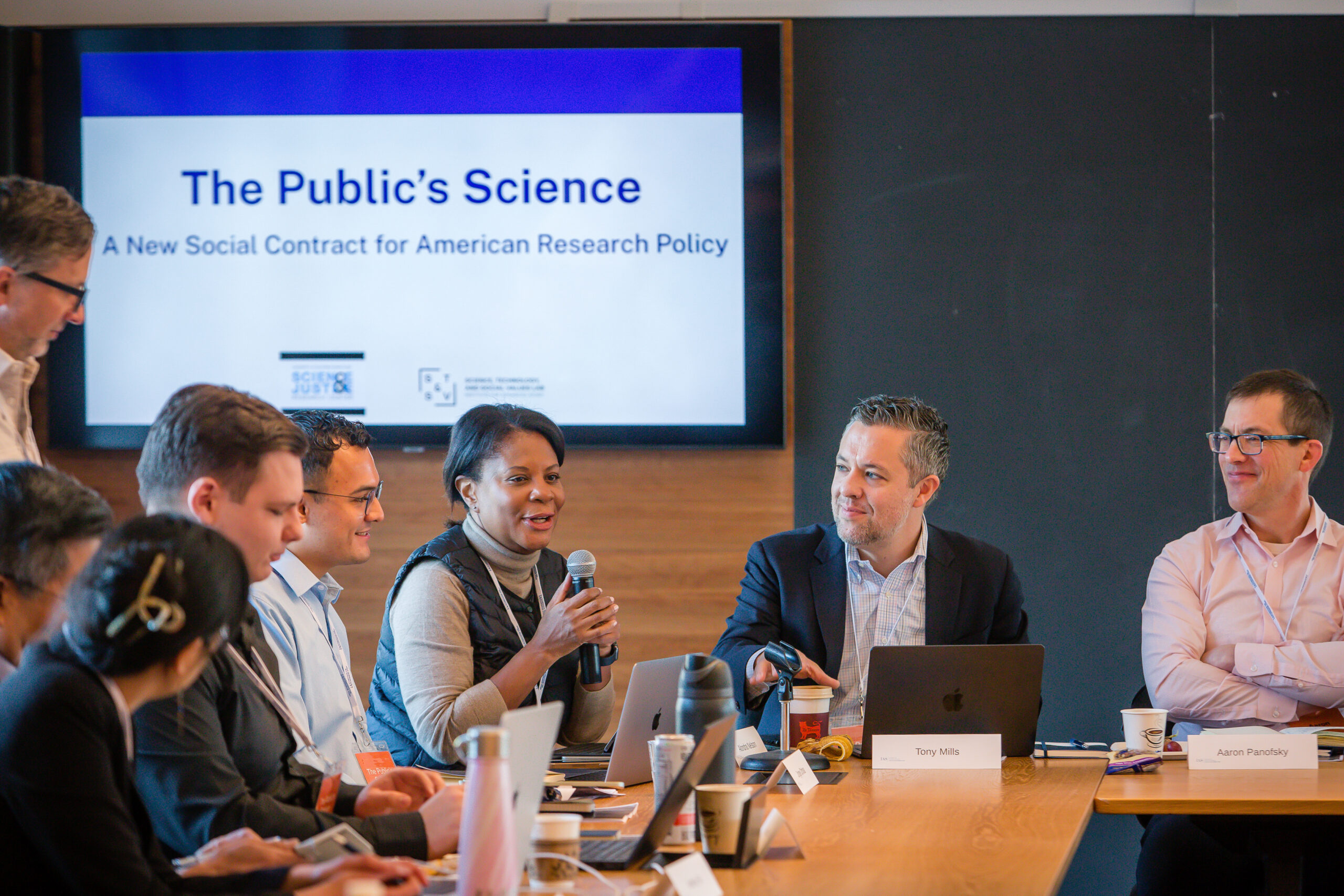 Alondra Nelson, holds a mic and speaks amongst other participants at the Public's Science launch event