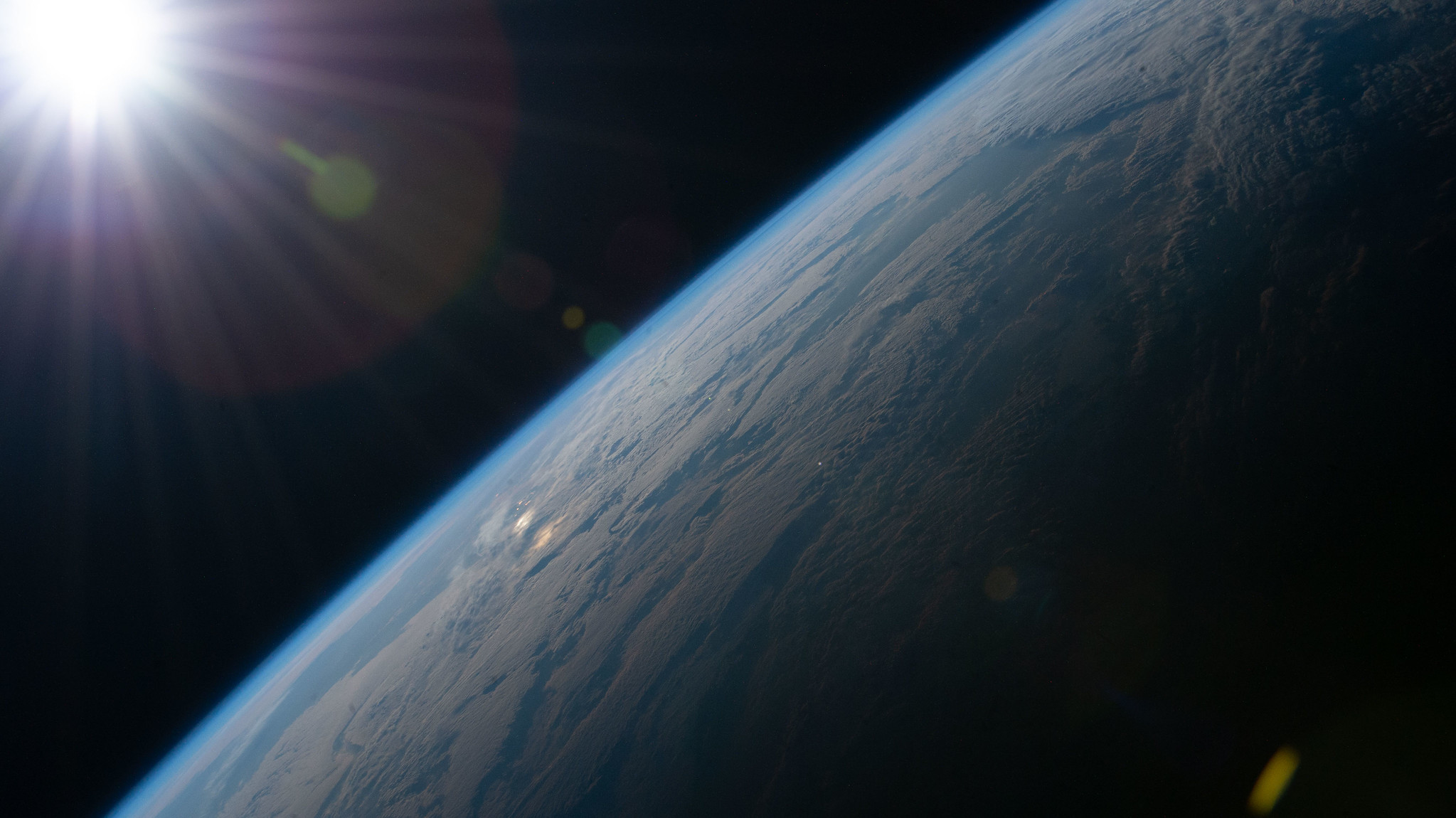 View from space as the Sun begins illuminating Earth’s surface.