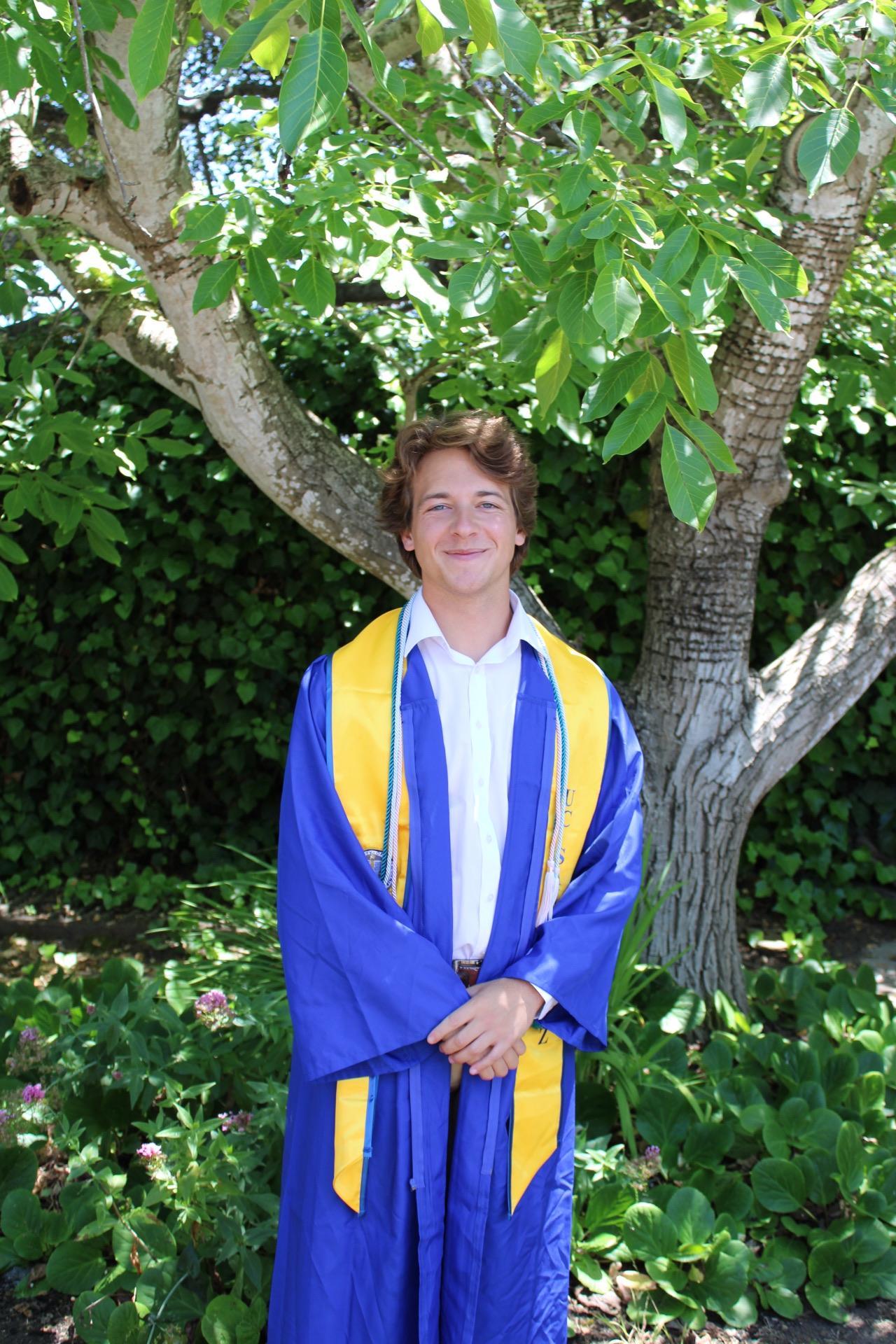 Brock Hrehor in graduation cap and gown