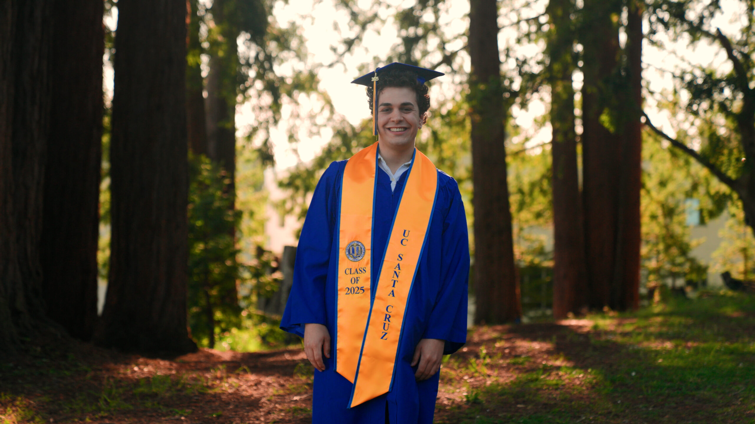 Owen Moosman at UC Santa Cruz in graduation gear.