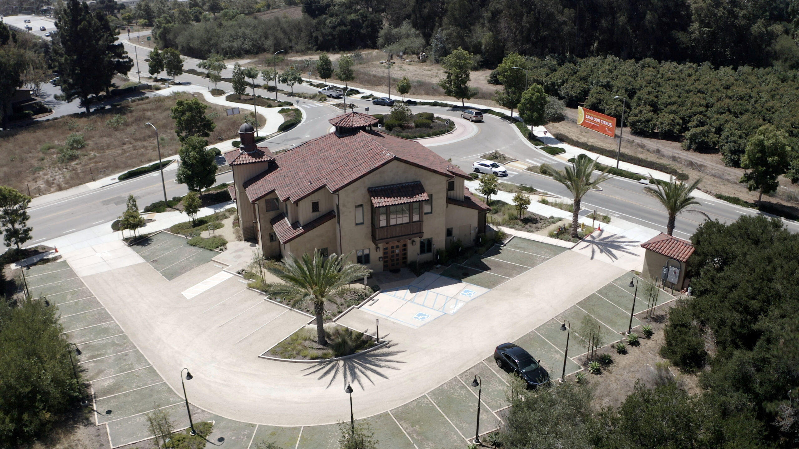 An aerial view of a mosque in Goleta, CA and it's surrounding parking lot.